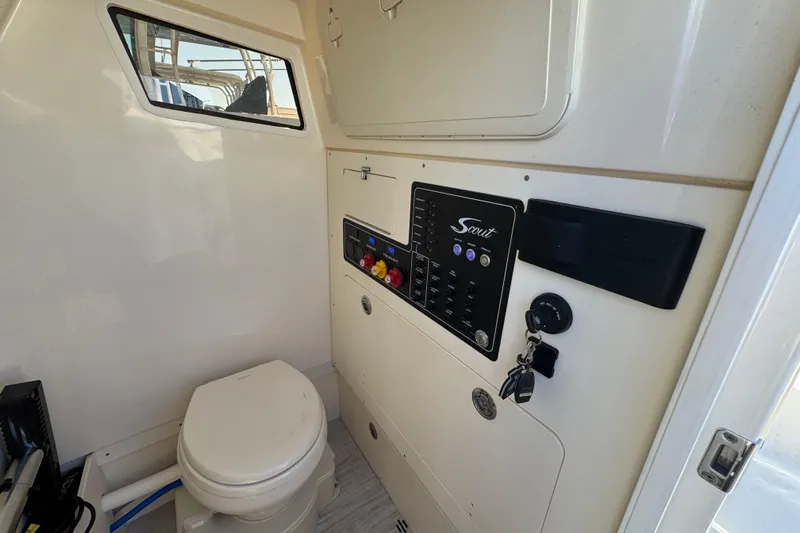  Yacht Photos Pics Interior of 2025 Scout 281 XSS boat featuring control panel and marine toilet.