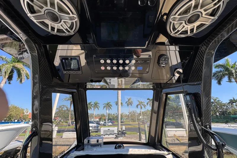  Yacht Photos Pics Interior view of 2025 Scout 281 XSS boat with advanced control panel and speakers.