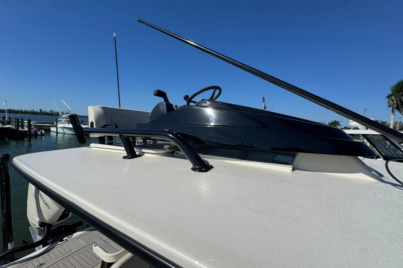  Yacht Photos Pics 2025 Scout 281 XSS boat with sleek design, docked under clear blue sky.