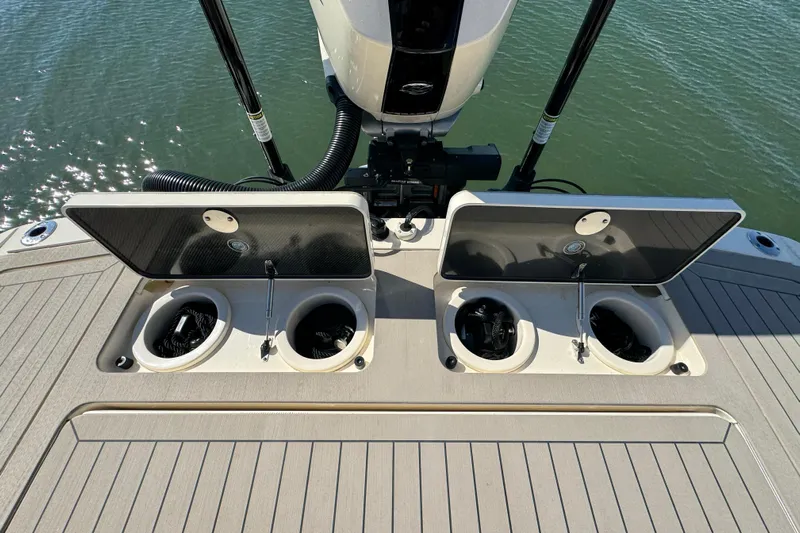  Yacht Photos Pics 2025 Scout 281 XSS boat deck with open storage compartments.