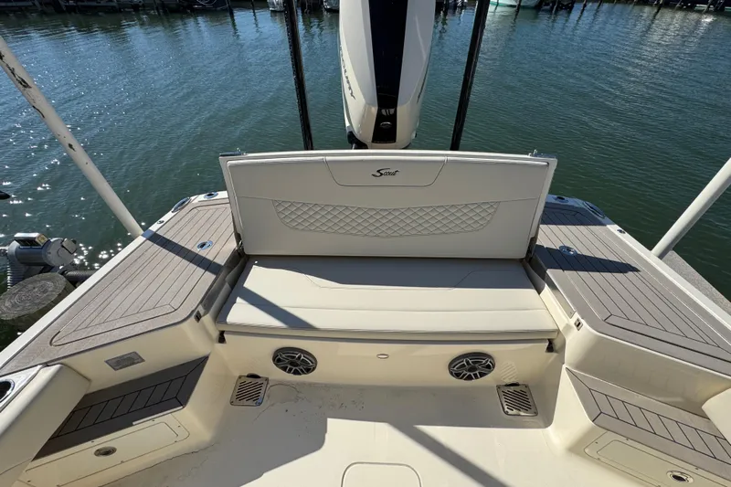 Yacht Photos Pics 2025 Scout 281 XSS boat interior with cushioned seating and water view.