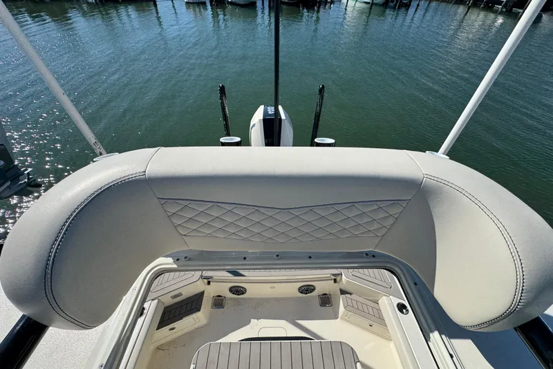  Yacht Photos Pics 2025 Scout 281 XSS boat interior with cushioned seating and water view.