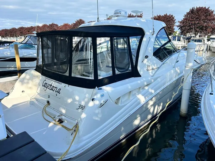 Cayetana Yacht Photos Pics 2004 Sea Ray 390 Sundancer docked at marina, featuring sleek design and enclosed cockpit.