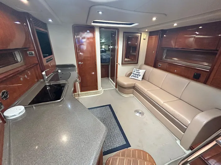 Cayetana Yacht Photos Pics Interior of 2004 Sea Ray 390 Sundancer yacht with modern kitchen and comfortable seating area.