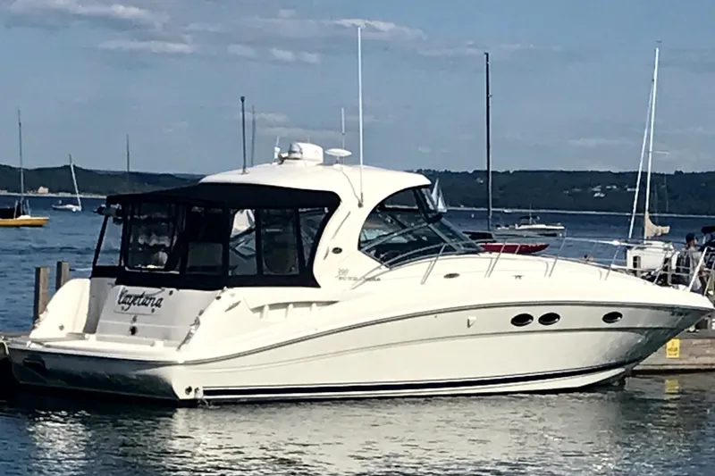 Cayetana Yacht Photos Pics 2004 Sea Ray 390 Sundancer yacht docked in a serene marina setting.