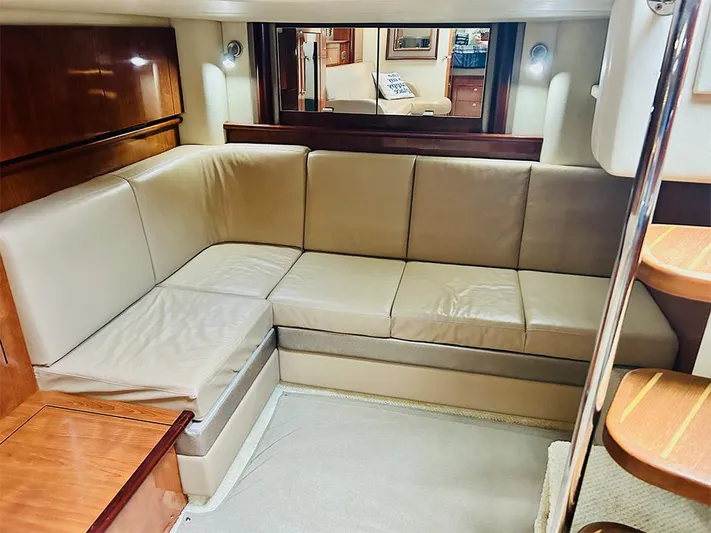 Cayetana Yacht Photos Pics 2004 Sea Ray 390 Sundancer interior with beige leather seating and wooden accents.