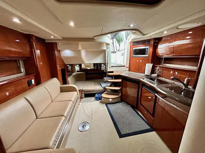 Cayetana Yacht Photos Pics Luxurious interior of a 2004 Sea Ray 390 Sundancer yacht with elegant wood finishes.