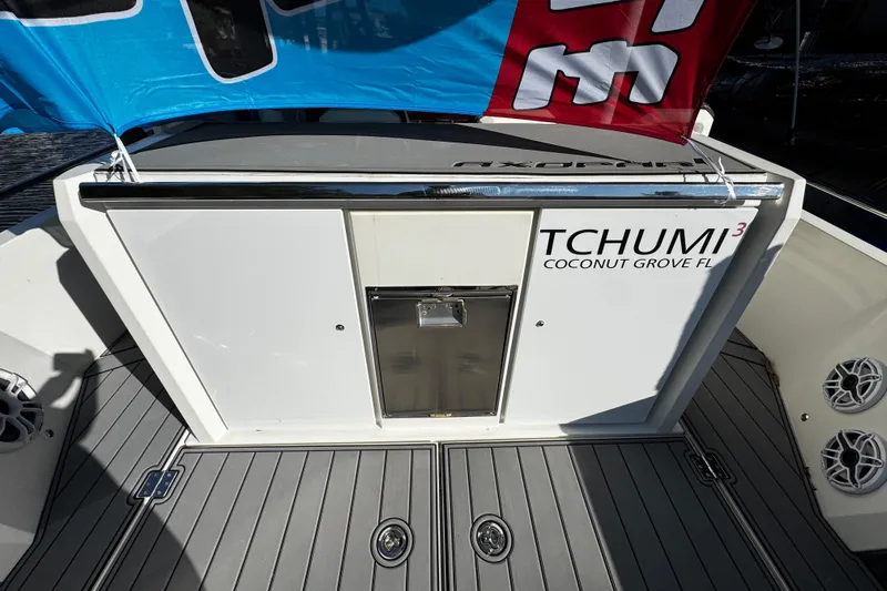  Yacht Photos Pics 2017 Axopar 37 Sun Top boat deck with "TCHUMI&sup3;" branding, Coconut Grove, FL.
