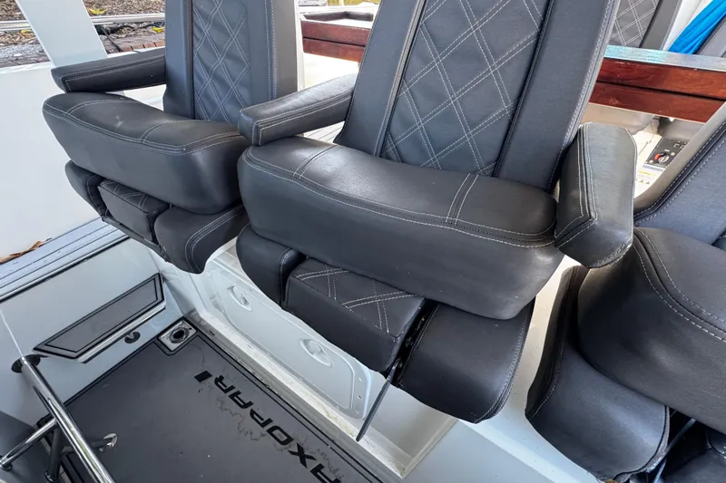  Yacht Photos Pics 2017 Axopar 37 Sun Top boat seats with black leather and diamond stitching.