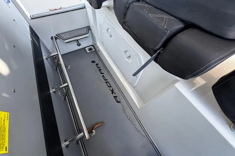  Yacht Photos Pics Interior view of 2017 Axopar 37 Sun Top boat, featuring seating and storage area.