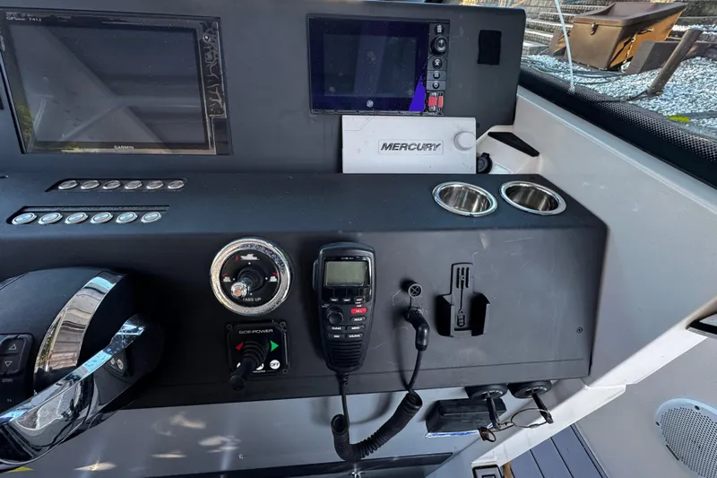  Yacht Photos Pics Control panel of 2017 Axopar 37 Sun Top boat with navigation and communication equipment.