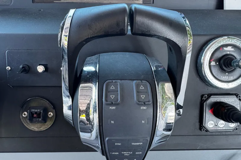  Yacht Photos Pics Control panel of a 2017 Axopar 37 Sun Top boat with throttle and switches.