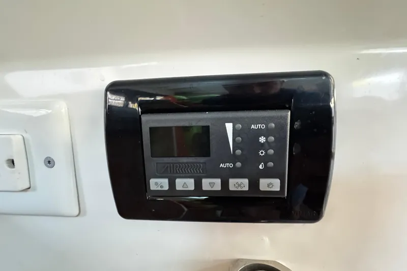  Yacht Photos Pics Control panel on 2017 Axopar 37 Sun Top boat, featuring various function buttons.