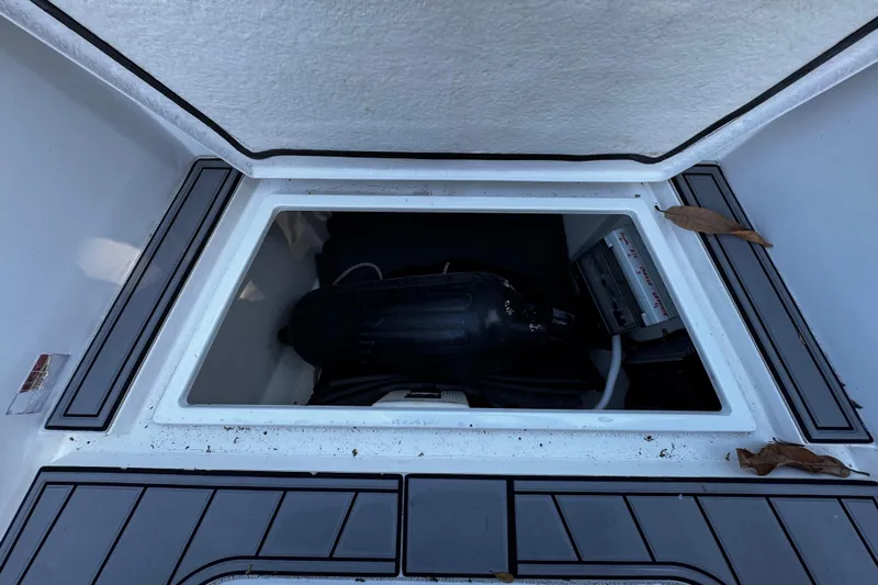  Yacht Photos Pics Open storage compartment on 2017 Axopar 37 Sun Top boat with visible equipment.