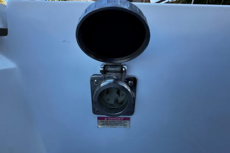  Yacht Photos Pics Power socket on 2017 Axopar 37 Sun Top boat with safety warning label.