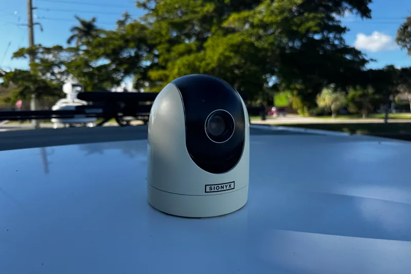  Yacht Photos Pics SIONYX camera on Axopar 37 Sun Top, 2017 model, with trees in the background.