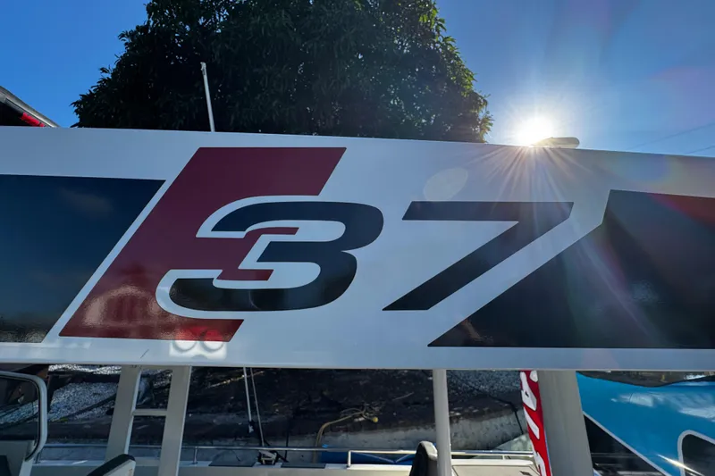  Yacht Photos Pics Axopar 37 Sun Top 2017 boat logo with sunlit background.