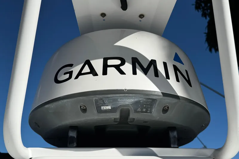  Yacht Photos Pics Garmin radar on 2017 Axopar 37 Sun Top boat against clear blue sky.