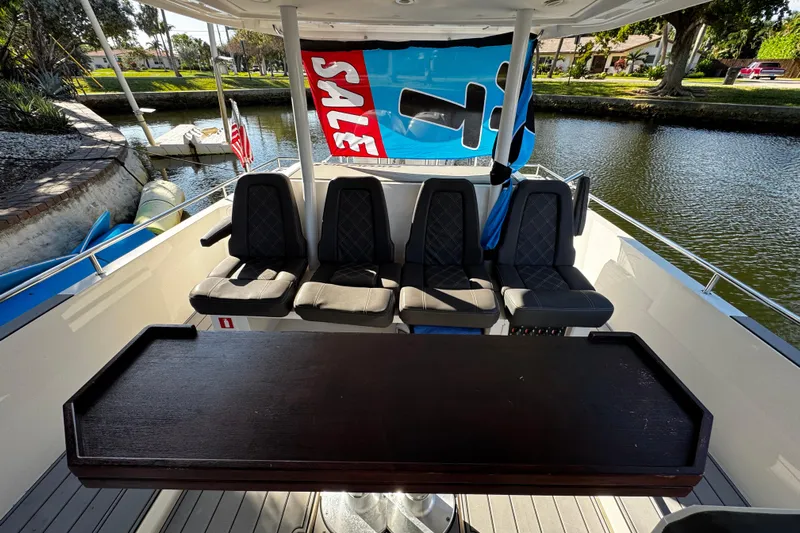  Yacht Photos Pics 2017 Axopar 37 Sun Top boat interior with seating and "For Sale" sign.