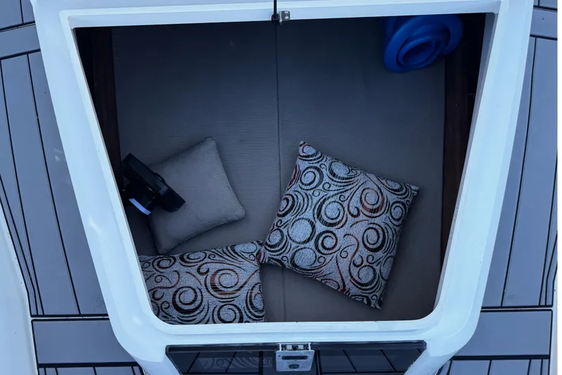  Yacht Photos Pics Cozy cabin interior of 2017 Axopar 37 Sun Top with decorative pillows.