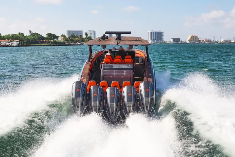  Yacht Photos Pics 2024 Midnight Express 43' Solstice speeding on water, showcasing powerful engines and sleek design.