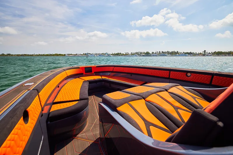  Yacht Photos Pics 2024 Midnight Express 43' Solstice boat with vibrant orange and black seating on open water.