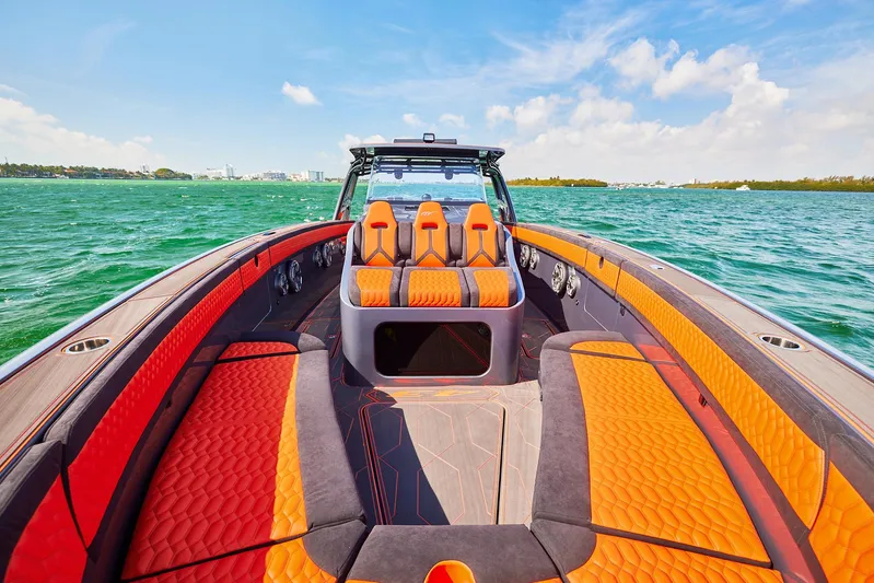  Yacht Photos Pics 2024 Midnight Express 43' Solstice boat with vibrant orange seating on open water.