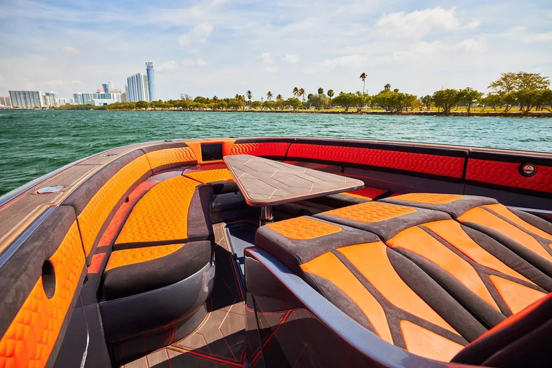  Yacht Photos Pics Luxurious 2024 Midnight Express 43' Solstice boat interior with vibrant seating and scenic waterfront view.
