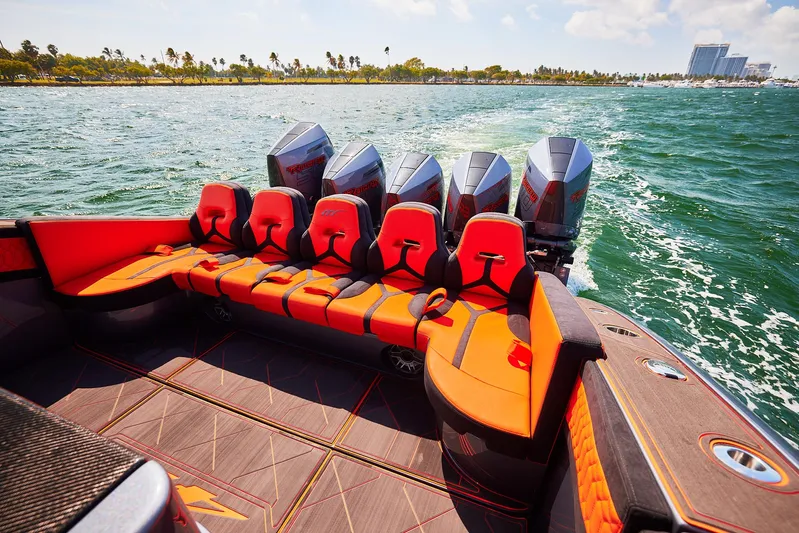  Yacht Photos Pics 2024 Midnight Express 43' Solstice boat with vibrant seating and powerful engines on open water.
