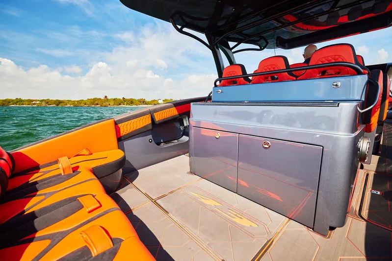  Yacht Photos Pics 2024 Midnight Express 43' Solstice boat interior with vibrant orange seating and sleek design.