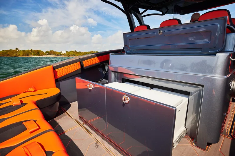  Yacht Photos Pics 2024 Midnight Express 43' Solstice boat interior with orange seating and storage compartments.