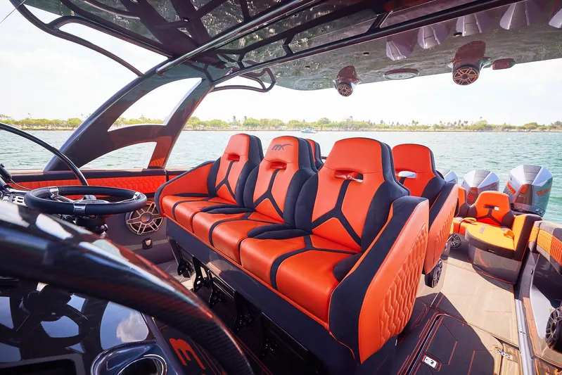  Yacht Photos Pics 2024 Midnight Express 43' Solstice boat interior with vibrant orange seating and sleek design.