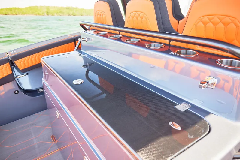  Yacht Photos Pics 2024 Midnight Express 43' Solstice boat interior with orange seating and sleek design.