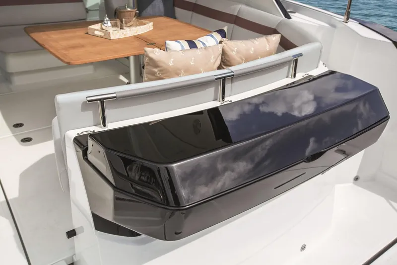  Yacht Photos Pics Beneteau 40 2019 model yacht interior with dining area and cushioned seating.