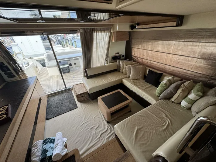 Odyssey Yacht Photos Pics Luxurious interior of 2013 Azimut 64 Fly yacht with cozy seating area.