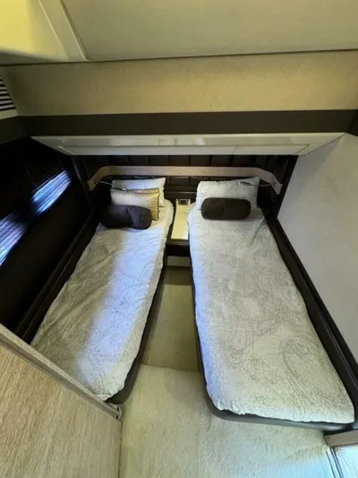 Odyssey Yacht Photos Pics Twin beds in the 2013 Azimut 64 Fly yacht cabin.