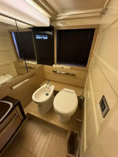 Odyssey Yacht Photos Pics Luxurious bathroom in a 2013 Azimut 64 Fly yacht with modern fixtures.