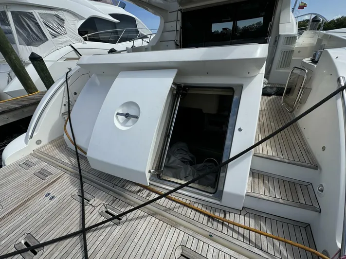 Odyssey Yacht Photos Pics 2013 Azimut 64 Fly yacht with open hatch and wooden deck.