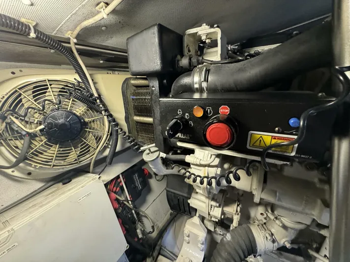 Odyssey Yacht Photos Pics Engine room of 2013 Azimut 64 Fly yacht with control panel and ventilation fan.