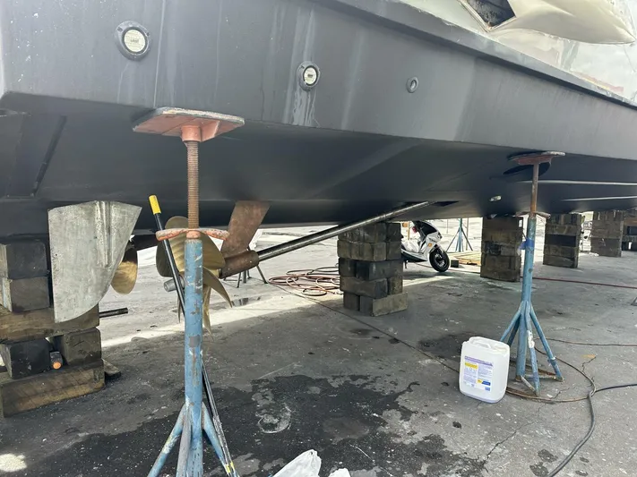 Odyssey Yacht Photos Pics 2013 Azimut 64 Fly yacht under maintenance, supported by stands and blocks.