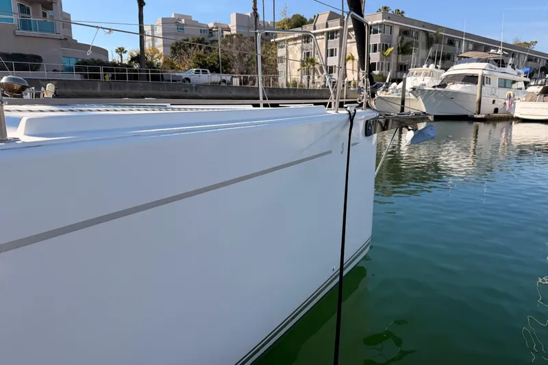 First 36 Yacht Photos Pics 2023 Beneteau First 36 sailboat docked in a marina, showcasing sleek design.