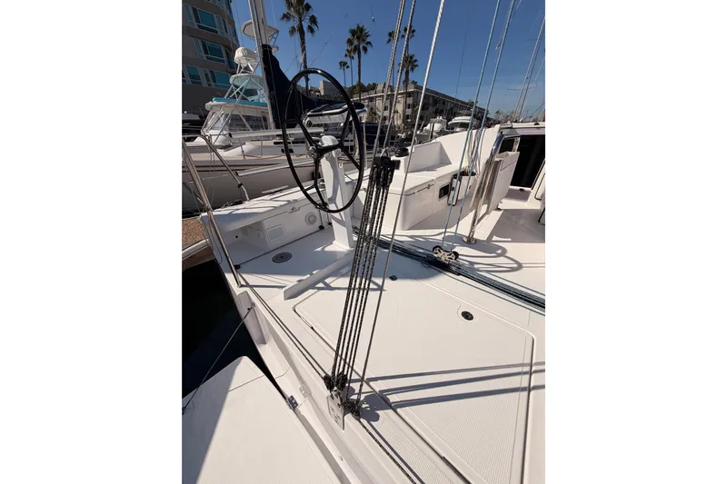 First 36 Yacht Photos Pics 2023 Beneteau First 36 sailboat deck with steering wheel and rigging.