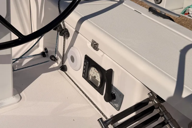First 36 Yacht Photos Pics Cockpit of 2023 Beneteau First 36 sailboat with steering wheel and control panel.