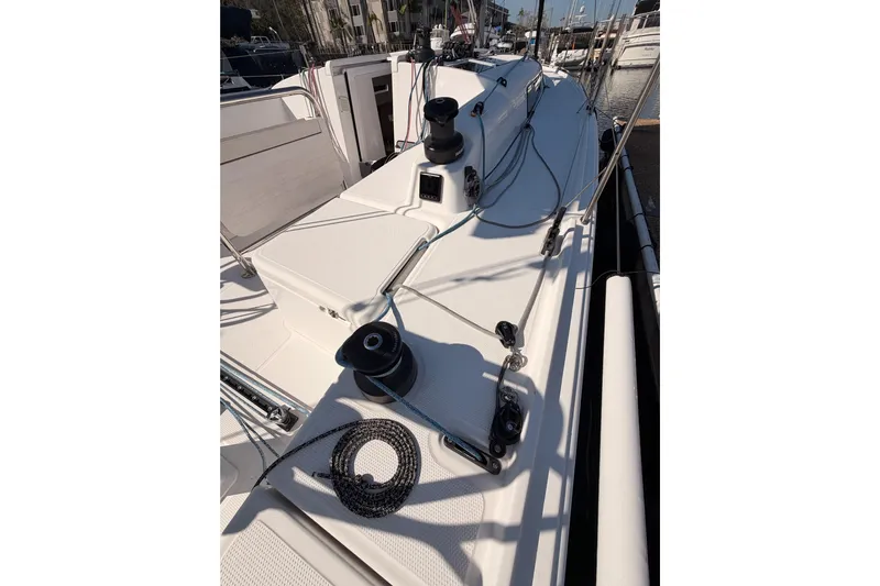 First 36 Yacht Photos Pics 2023 Beneteau First 36 sailboat deck with winches and rigging in marina.