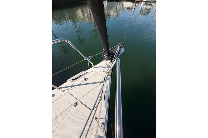 First 36 Yacht Photos Pics Bow view of 2023 Beneteau First 36 sailboat docked in calm waters.