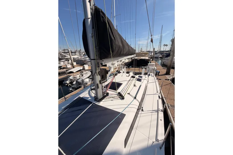 First 36 Yacht Photos Pics 2023 Beneteau First 36 sailboat docked at marina under clear blue sky.