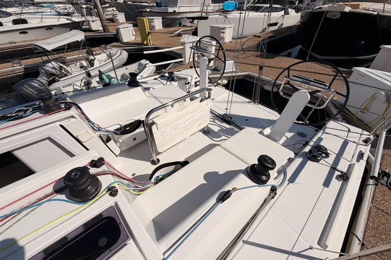 First 36 Yacht Photos Pics 2023 Beneteau First 36 sailboat cockpit with dual steering wheels and winches at marina.