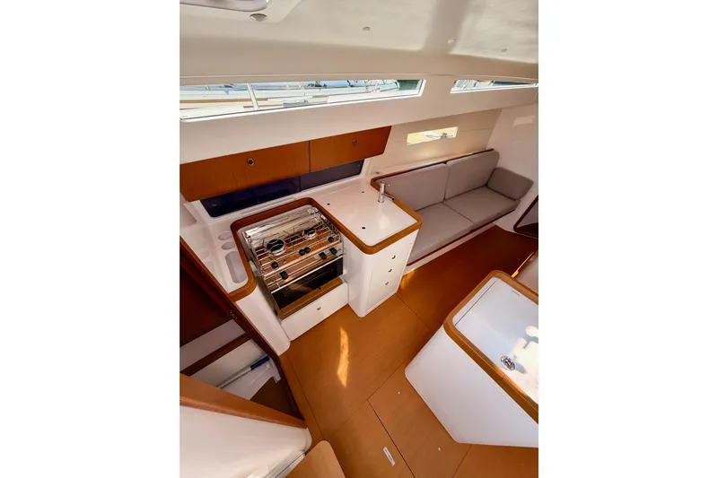First 36 Yacht Photos Pics Interior of 2023 Beneteau First 36 yacht, featuring modern kitchen and seating area.