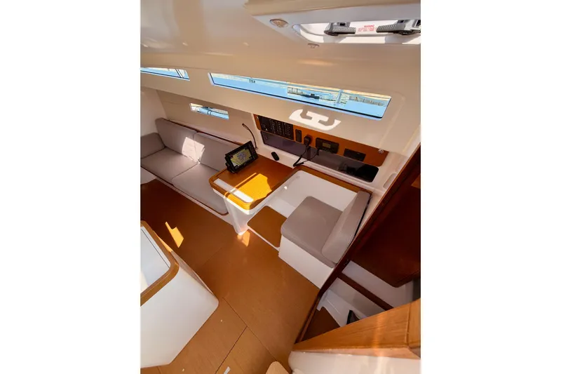 First 36 Yacht Photos Pics Interior of 2023 Beneteau First 36 sailboat, featuring modern seating and navigation equipment.