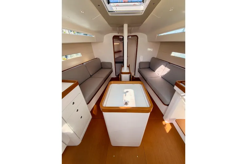First 36 Yacht Photos Pics Interior of 2023 Beneteau First 36 sailboat, featuring modern seating and sleek design.